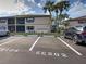 Exterior shot of condo building with dedicated parking spots visible at 19505 Quesada Ave # Ee202, Port Charlotte, FL 33948