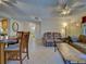 View of the living room showing the furnishings and tile floors at 19505 Quesada Ave # Ee202, Port Charlotte, FL 33948