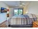 The main bedroom is spacious and provides access to the balcony and adjacent living room at 19505 Quesada Ave # Ee202, Port Charlotte, FL 33948