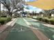 Shuffleboard courts nestled amongst greenery and shade in a friendly community at 19505 Quesada Ave # Ee202, Port Charlotte, FL 33948