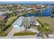 Waterfront home with lush greenery, private boat dock, and canal views offering serenity and picturesque scenery at 1960 W Marion Ave, Punta Gorda, FL 33950