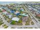 Picturesque aerial view capturing waterfront homes along winding canals, enhanced by lush landscaping and neighborhood appeal at 1960 W Marion Ave, Punta Gorda, FL 33950