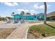 Inviting backyard with a cozy fire pit, comfortable seating, and access to a refreshing pool at 1960 W Marion Ave, Punta Gorda, FL 33950