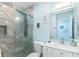 Modern bathroom with a glass shower and a white vanity with a sink and a mirror at 1960 W Marion Ave, Punta Gorda, FL 33950