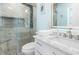 Elegant bathroom features a frameless shower, marble countertops, and modern fixtures at 1960 W Marion Ave, Punta Gorda, FL 33950
