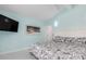 Comfortable bedroom with tropical-themed decor creates a relaxing retreat in your own home at 1960 W Marion Ave, Punta Gorda, FL 33950