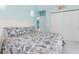 Comfortable bedroom with sliding door and tropical-themed decor creates a relaxing retreat at 1960 W Marion Ave, Punta Gorda, FL 33950