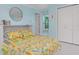 Cozy bedroom with a Murphy bed, white closet doors and coastal decor at 1960 W Marion Ave, Punta Gorda, FL 33950