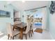 Elegant dining room with a modern table, sliding glass doors, and view of the pool at 1960 W Marion Ave, Punta Gorda, FL 33950