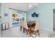 Charming dining area with sliding glass doors offering a view of the pool and outdoor area at 1960 W Marion Ave, Punta Gorda, FL 33950