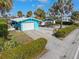 Charming home featuring a garage, spacious driveway, and lush landscaping for curb appeal at 1960 W Marion Ave, Punta Gorda, FL 33950