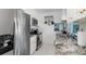 Modern kitchen boasts stainless steel appliances, white cabinets, and striking granite countertops at 1960 W Marion Ave, Punta Gorda, FL 33950