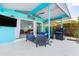 Stylish patio with comfortable seating, an outdoor grill, and serene views for relaxed living at 1960 W Marion Ave, Punta Gorda, FL 33950