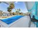 Outdoor pool features seating, a bar area, and water access, all enhancing its relaxing atmosphere at 1960 W Marion Ave, Punta Gorda, FL 33950