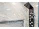 Elegant shower with premium fixture and marble tile. Enjoy a modern and sleek shower at 1960 W Marion Ave, Punta Gorda, FL 33950