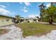 View of home with gravel area and grass at 212 Gulf Ave, Nokomis, FL 34275