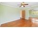 Light green bedroom featuring hardwood floors and mirrored closet doors at 212 Gulf Ave, Nokomis, FL 34275