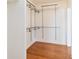 Organized walk-in closet with adjustable shelving and storage solutions for maximum convenience at 212 Gulf Ave, Nokomis, FL 34275