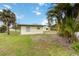 Charming cottage-style home with lush landscaping and a well-maintained lawn at 212 Gulf Ave, Nokomis, FL 34275