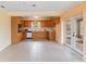 Eat-in kitchen features classic wooden cabinets and stainless steel appliances at 212 Gulf Ave, Nokomis, FL 34275