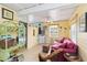 Quaint living room with tropical decor, tile floors, and a comfortable seating area at 212 Gulf Ave, Nokomis, FL 34275