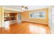 Bright open-concept living and kitchen space with hardwood floors and ample natural light at 212 Gulf Ave, Nokomis, FL 34275