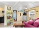 Cozy living room with bright walls and an entertainment center that creates a relaxing atmosphere at 212 Gulf Ave, Nokomis, FL 34275