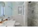 This bathroom offers a marble walk-in shower, and new fixtures, including a sink, toilet and towel rack at 217 Palm E Ave, Nokomis, FL 34275