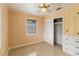 This bedroom has a ceiling fan, closet, built in cabinets, and a window with blinds at 217 Palm E Ave, Nokomis, FL 34275