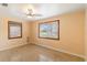 Comfortable bedroom features natural light from two windows and polished terrazzo flooring at 217 Palm E Ave, Nokomis, FL 34275