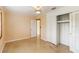 Comfortable bedroom featuring closet, ceiling fan, terrazzo floor, and neutral paint at 217 Palm E Ave, Nokomis, FL 34275