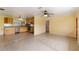 Open floor plan showing stainless steel kitchen with view into the large living room at 217 Palm E Ave, Nokomis, FL 34275