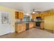 Efficient kitchen with wooden cabinetry, stainless steel appliances, and adjacent dining area at 217 Palm E Ave, Nokomis, FL 34275