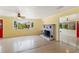 Spacious living room featuring a decorative fireplace and sunroom access at 217 Palm E Ave, Nokomis, FL 34275