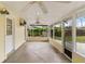 Comfortable screened porch featuring ceiling fans, and access to the backyard, perfect for relaxing and entertaining at 217 Palm E Ave, Nokomis, FL 34275
