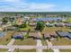 Aerial shot of a residential neighborhood featuring single-Gathering homes and a scenic lake at 2304 Bonn Ct, Punta Gorda, FL 33983