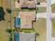 Bird's eye view of a home with a screened-in pool and lush landscaping at 2304 Bonn Ct, Punta Gorda, FL 33983