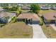 Overhead view of a single-Gathering home with a well-manicured lawn and brick driveway at 2304 Bonn Ct, Punta Gorda, FL 33983