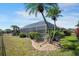 Screened-in pool surrounded by well-maintained landscaping and a lush green lawn at 2304 Bonn Ct, Punta Gorda, FL 33983