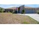Well-maintained home with brick accents, manicured landscaping, and a two-car garage at 2304 Bonn Ct, Punta Gorda, FL 33983