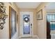 Bright foyer with tiled floors, decorative accents, and a stylish front door with stained glass at 2304 Bonn Ct, Punta Gorda, FL 33983