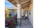 Inviting covered front porch with stone columns, lush landscaping, and a welcoming entrance at 2304 Bonn Ct, Punta Gorda, FL 33983