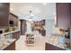Large kitchen with granite countertops, stainless appliances, pendant lighting, and plenty of counter space at 2304 Bonn Ct, Punta Gorda, FL 33983