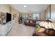 Comfortable living room featuring tile floors, neutral walls, and an inviting seating area at 2304 Bonn Ct, Punta Gorda, FL 33983
