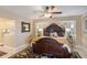 Spacious main bedroom with exquisite furnishings and decor, including a decorative ceiling fan at 2304 Bonn Ct, Punta Gorda, FL 33983