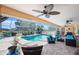 Inviting screened-in pool area with outdoor seating, perfect for enjoying the Florida sunshine at 2304 Bonn Ct, Punta Gorda, FL 33983