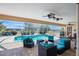 Relaxing screened-in pool area with comfortable seating, ceiling fans, and a grill at 2304 Bonn Ct, Punta Gorda, FL 33983