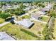 A lovely home with a well-kept lawn in a quiet neighborhood with tree coverage at 23482 Moreland Ave, Port Charlotte, FL 33954