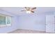 Light-filled bedroom showcasing neutral walls, a ceiling fan, and a window for natural light and ventilation at 23482 Moreland Ave, Port Charlotte, FL 33954