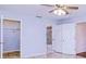 Spacious bedroom with tiled floors, ceiling fan, and closet at 23482 Moreland Ave, Port Charlotte, FL 33954